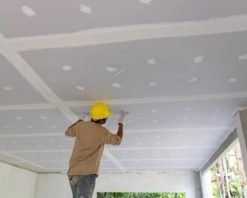 Craftsman working with plaster gypsum ceiling for interior build gypsum board ceiling